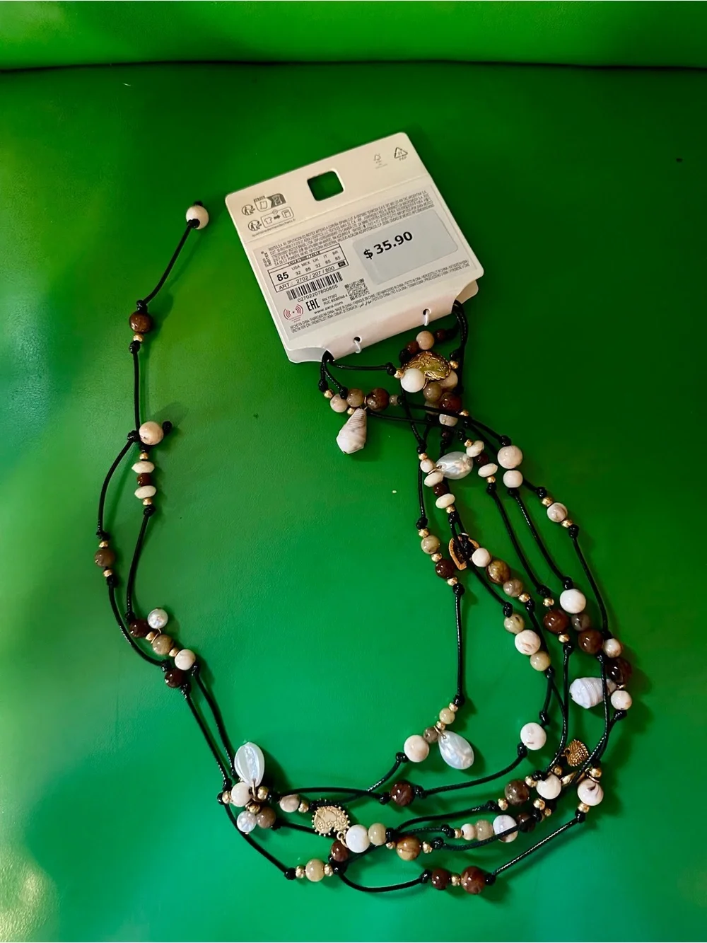 Zara Layered Bead Necklace in White and Brown with Gold Accents - Picture 4 of 4